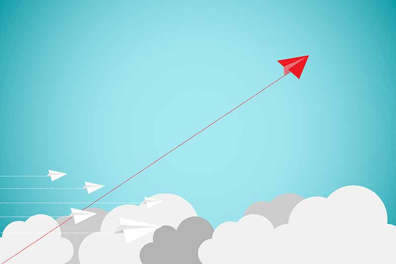 Icon of red paper airplane flying up in an upward trend representing the concept of increased private aviation flights in 2025 and beyond