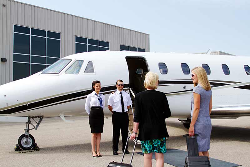 People boarding a private jet