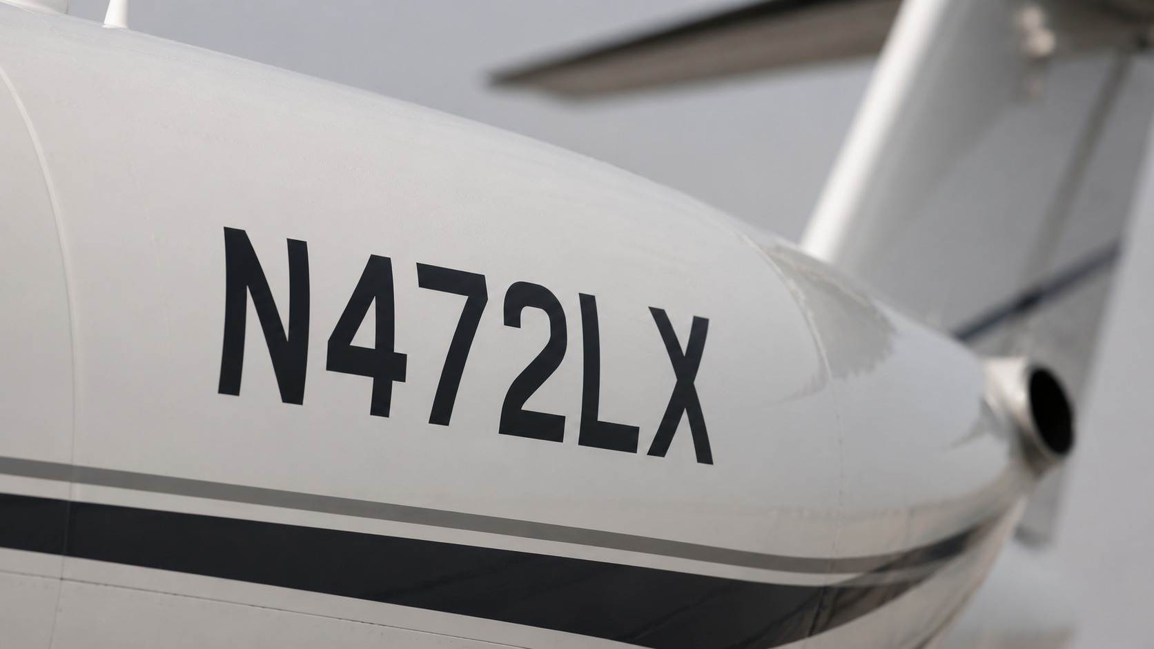  Close-up of a private jet tail registration number on the aircraft fuselage