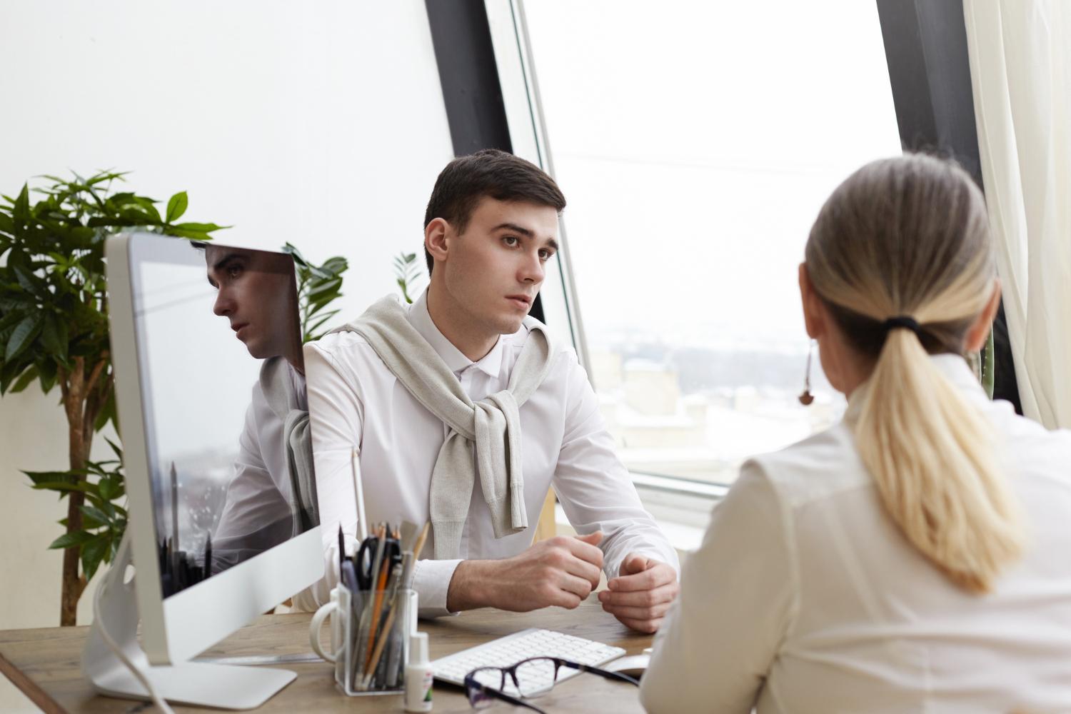 Man and woman at a desk